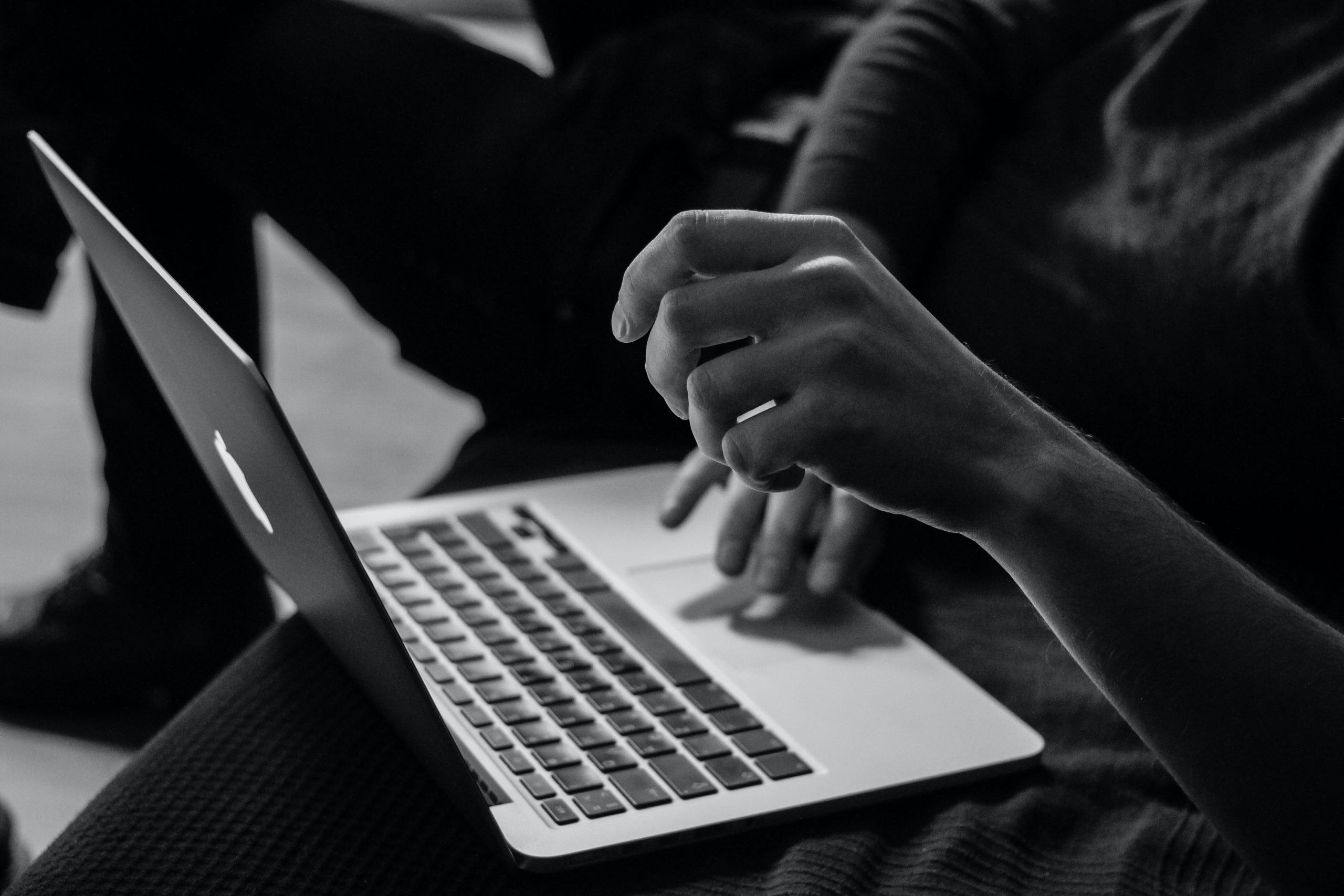 Person searching for an internet deal on a laptop.